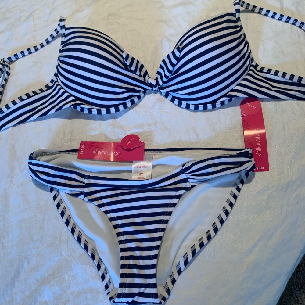 LARGE top, SMALL bottom.  NWT/never worn. Super cute. Underwire top w/knot